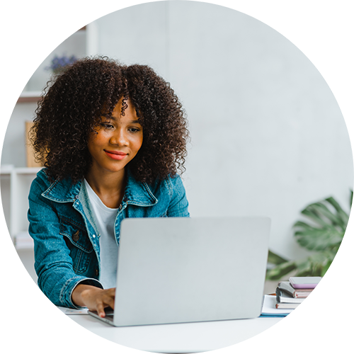 Woman using a laptop at a table