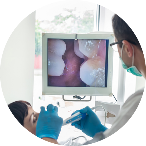 Dentist closely examining a patient's mouth